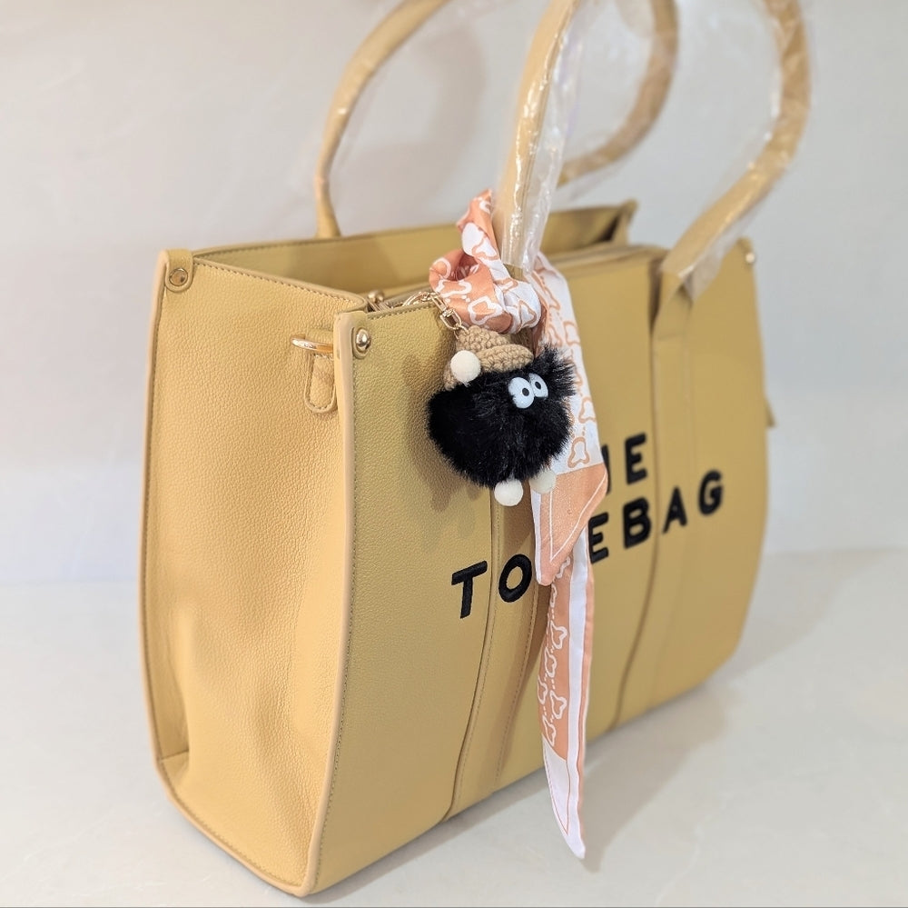 Beige Faux Leather Tote Bag with Decorative Scarf and Charm