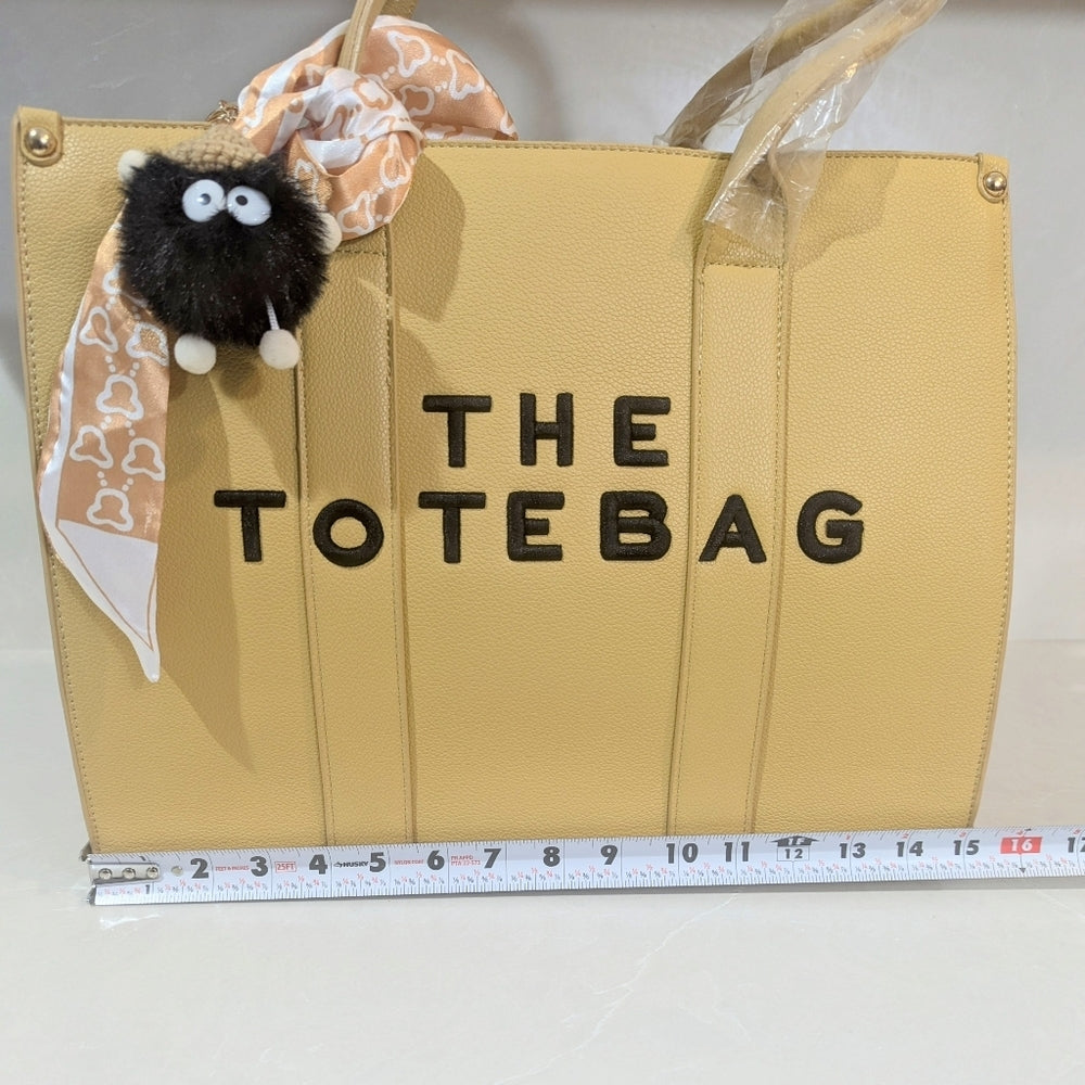 Beige Faux Leather Tote Bag with Decorative Scarf and Charm